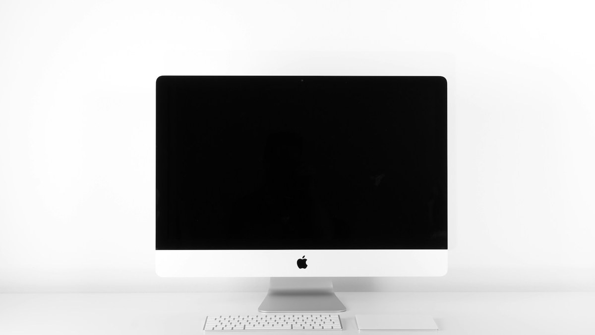 Ergonomic desk workstation setup with monitor height alignment and supportive seating
