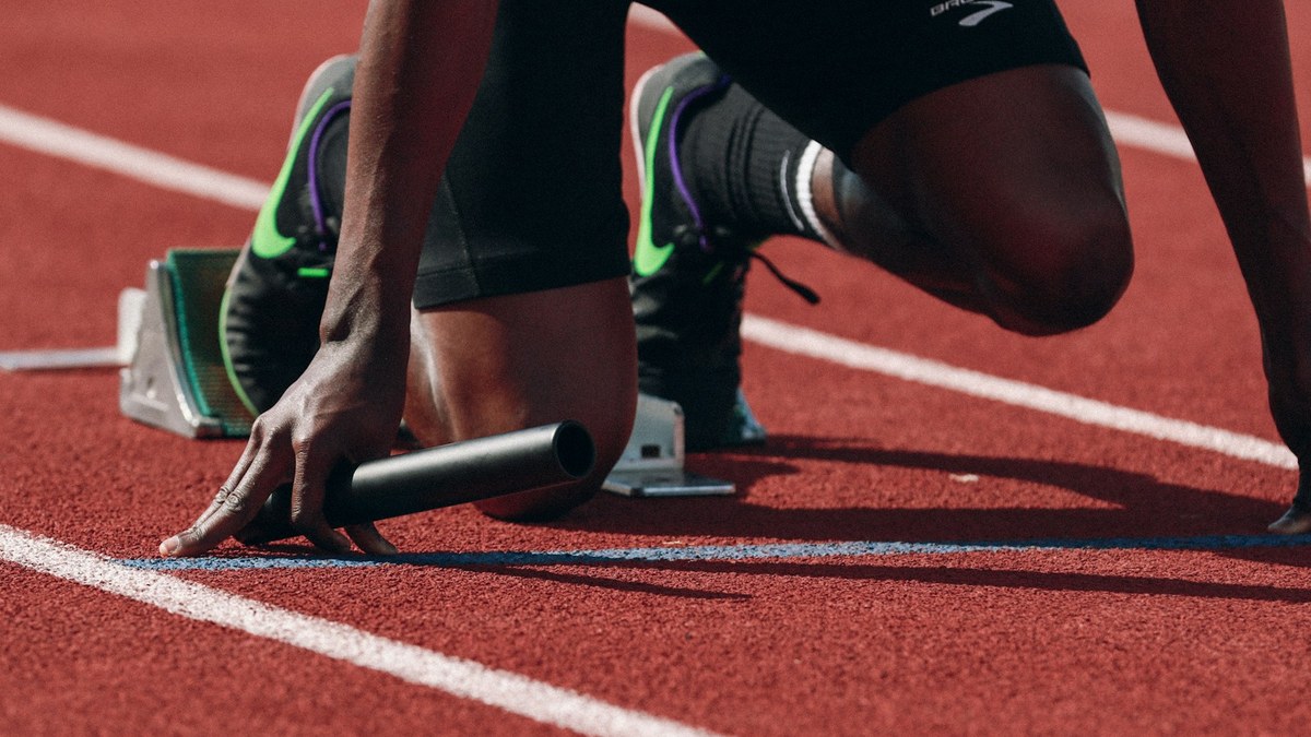 Athlete performing functional warm-up and graded return to running